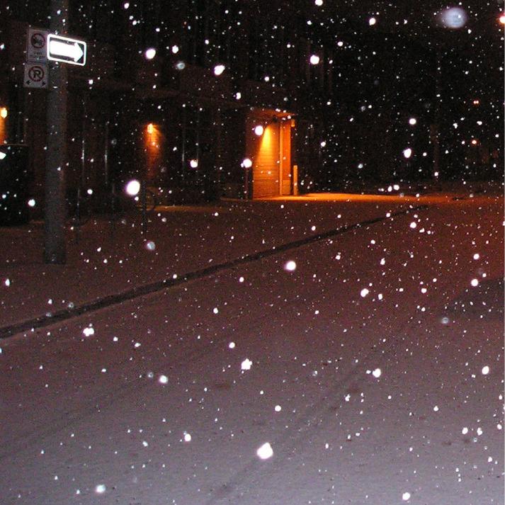 Snowy street at night